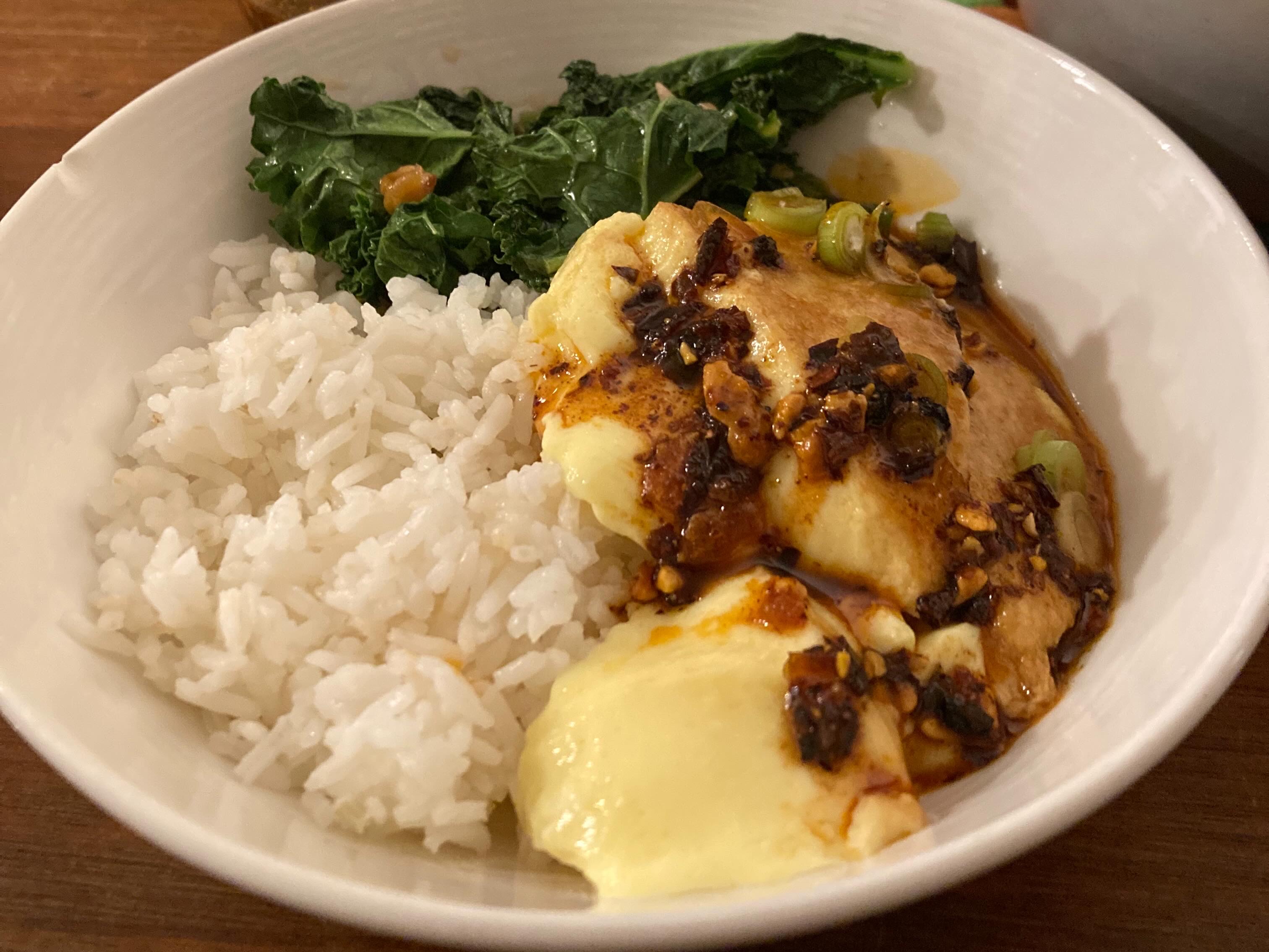 Chili crisp over savory custard and rice